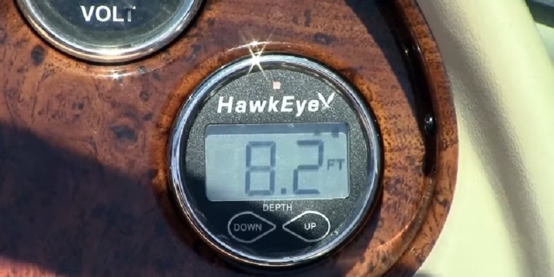 A close-up of a boat-mounted Hawkeye DepthTrax 2B fish finder